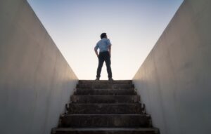 CEO at the top of the stairs looking out toward the future.