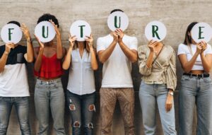 Gen Z workers holding words that spell "future"