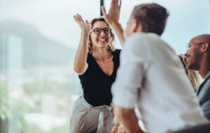 Leader high-fiving employee