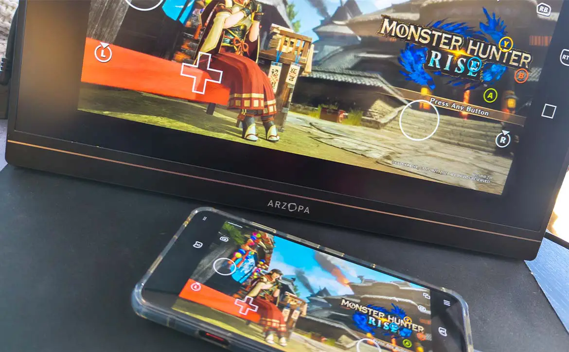 The Arzopa G1 Game 15.6" Portable Gaming Monitor connected to a smartphone